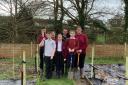 Students at Ravenswood School planting the trees