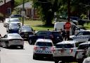 Multiple law enforcement vehicles respond in the neighborhood where several officers on a task force trying to serve a warrant were shot (Khadejeh Nikouyeh/The Charlotte Observer via AP/PA)