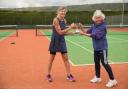 Cheddar Tennis Club Ladies winner Juliet Knight (left) with Sarah Strawbridge presenting the trophy.