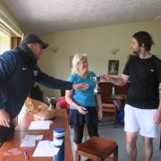 Winscombe head coach Mike Cook presenting the Mixed Doubles Winners' Trophy to Sally Thompson and Ant Moodie.