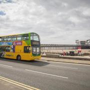A bus in front of Weston-super-Mare's Grand Pier.