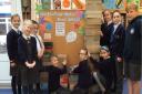 Sandford pupils help prepare the shoeboxes for delivery.