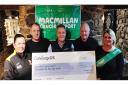 From left to right, Kelly Hillier (fundraiser) Matt Tyler (ConciergeUK) Wayne Hadley (ConciergeUK) Phil Hucker (Manchester United Legends Team Manager) and Lisa Konkol (Fundraiser) with the cheque of £558 for MacMillan Cancer Support.
