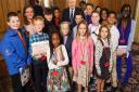 Elijah Maxwell stood with Jill Dando students and Prime Minister Boris Johnson.Picture: TKASA