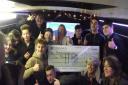 Youngsters from the Grow Your Own Youth project with the cheque from Persimmon Homes.