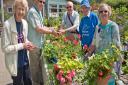 Plant sale, Chris Swatton, Denis Hawkings and Kay Bebb with customers John Fry and Val Clare.