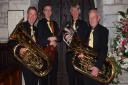 Members of the WorleWind Band, with oldest member Ken Heeney on right,
