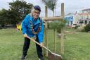 Mayor Cllr Sonia Russe plants a Scots Pine on the water park grounds.