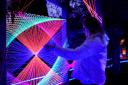 A GLOW Festival visitor experiences Bev G Star's Entwined installation.