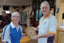 St Andrews captain Robin Potter (left)receiving the Jim McClelland Shield from Clarence captain Pete Williams.