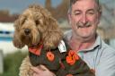 Philip Lloyd-Evans with his dog Lottie who had helped him sell poppies for Remembrance Day.