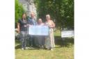 Former Weston-super-Mare Sonia Russe presenting a cheque to  North Somerset Parent Carers Working Together (NSPCWT).