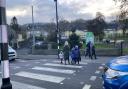 Crossing the zebra crossing to get to school