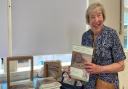 Former Weston Museum curator Jane Evans with her book on George Cumberland.