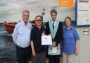 The Masonic Master hands a cheque to Weston's RNLI. (L-R) Christopher Ware RNLI operations manager, Peter Elmont RNLI fundraising chairman, Stephen Fry Masonic Master, Judith Hayes RNLI fundraising Treasurer.