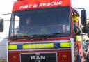 A man in his X was taken to hospital after a fire broke out in a shop below his home.