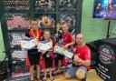 Brothers Liam Cawte, Ryan Cawte, Josh Cawte, with their Somerset Kickboxing Instructor Paul Holder.