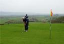 Golfers in action at Wedmore Golf Club.