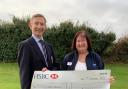 Weston Golf Club seniors captain John Whitewood presents the cheque of £3,750 to  RSPCA North Somerset fundraising manager Dawn Pawlett