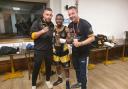 Abdou Aziz Coker (centre) celebrating his win over Kian Foley with Ross Grindrod (left) and Carl Fox (right).