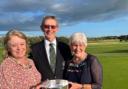 John Whitewood and his wife Alison Whitwood being presenting with the trophy by Sally Irlam.