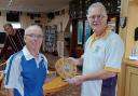 St Andrews captain Robin Potter (left)receiving the Jim McClelland Shield from Clarence captain Pete Williams.