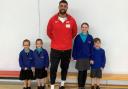 James Tomlinson with Haywood Village Academy students.