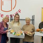 Volunteers from the Healthy Living Centre pictured donating unused food.