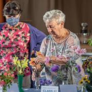 Jacki Parkinson and Susan Taylor setting out exhibits at Banwell Gardening Club Show .