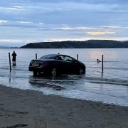 The car was engulfed by the high tide in Weston last night.