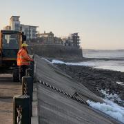 Marine Lake's faulty sluice gates have been removed and diggers are churning up the silt to enable the spring tides to flush it out.