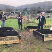 Rotarians and volunteers from SPACE charity working on the allotment in Cheddar.