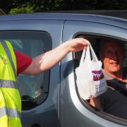 Mendip Rotarians hand out meals prepared by member Anwar Hussain.    Picture: Rotary Club of Mendip