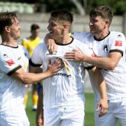 Weston AFC Keiran Thomas, centre, celebrates his goal with Jacob Jagger-Cane, left and Dayle Grubb, right, against Gosport Borough.