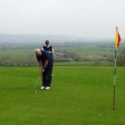 Golfers in action at Wedmore Golf Club.