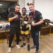 Abdou Aziz Coker (centre) celebrating his win over Kian Foley with Ross Grindrod (left) and Carl Fox (right).