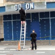 Workers taking down the Odeon sign in Weston-super-Mare