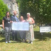 Former Weston-super-Mare Sonia Russe presenting a cheque to  North Somerset Parent Carers Working Together (NSPCWT).