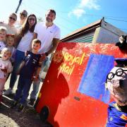 The Wilkins family and friends with a Postman Pat scarecrow display in Brent Knoll last year.