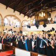 A traditional mortarboard toss created an uplifting memory for the graduates.