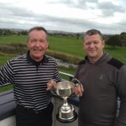 Les Byrne (left) and Gareth Davies (right) with The John Smith Trophy at Brean Golf Club.