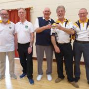 The Ashcombe players had their trophy presented by league Chairman Mike Davis (centre).
