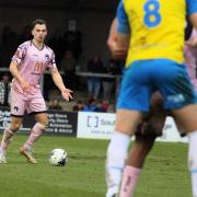 Retained midfielder James Dodd on the ball against Torquay United