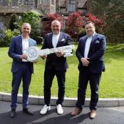 Jason Eaton, health club general manager, Nick Taplin, owner, Gareth Ireland, general manager 'handing the key to the house'.