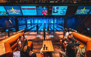 People enjoy bowling at the new arena.