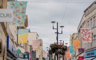 The 32 flags above Weston High Street.